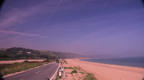 Car on straight seadside road 動画素材 38549055