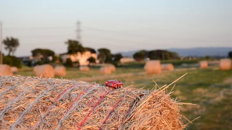 Car on a straw bale Stock Footage 76358653