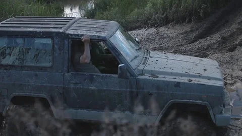 Car stuck in the mud Stock Footage 71306668