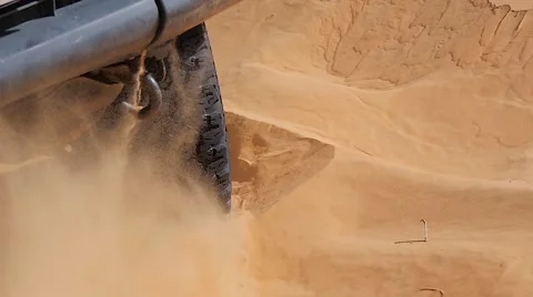 Car stuck in sand Stock Footage 58384493