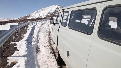 Car stuck in the snow in the mountains 2 (caucasus) Stock Footage 83677650