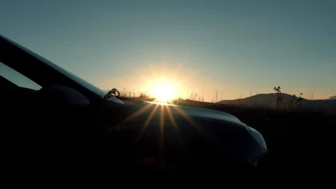 Car on sunset Mountain Ranges Stock Footage 98450982