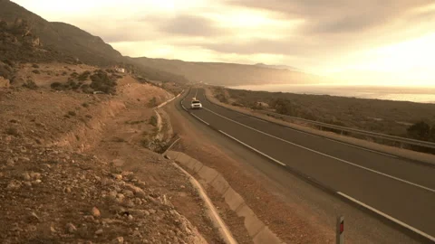 Car with surfboard on Morocco road Stock Footage 240907219