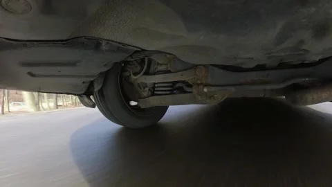 Car Suspension System When Driving Panning Wide Angle View Video stock 133988456