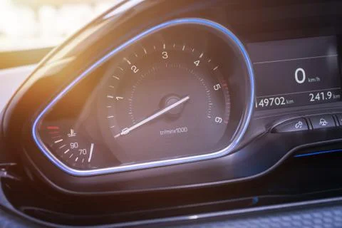 Car tachometer close up. Modern interior with blue led light. Stock Photos