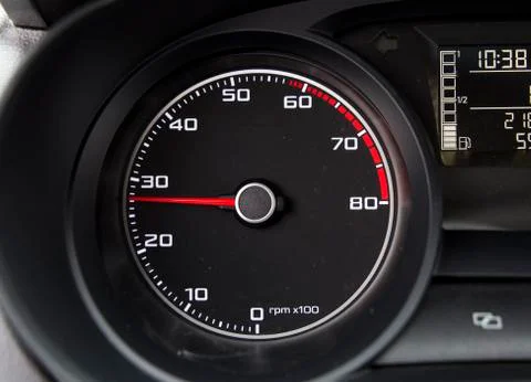 Car tachometer with pointer showing middle power Stock Photos