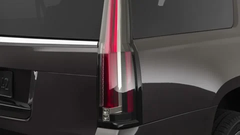Car tail light close up Dark Granite Metallic 2018 Cadillac Escalade ESV Luxury Stock Footage 159986106