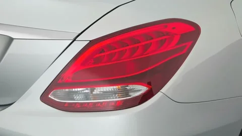 Car tail light close up Iridium Silver Metallic 2017 Mercedes-Benz C-Class C300 Stock Footage 159931847