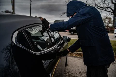 Car theft break in broad daylight Stockfoto's