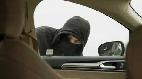 Car thief skillfully bypasses vehicle's security system carjacking process Stock Footage 274103190