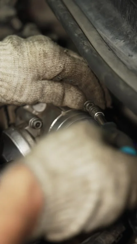 Car throttle body unit installed inside a dusty engine bay. Stock Footage 341484717