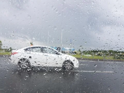 The car through the wet window Stock Photos