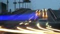 Car timelapse dusk, long light traces, driving city vehicles HD Footage