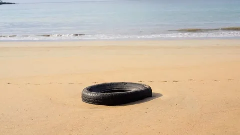 Car Tire On A Beach Stock Footage 330792173