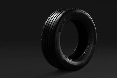 Car tire on dark background Stock Photos