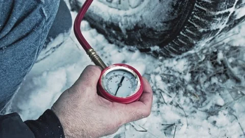 Car tire pressure check using air pressure guage Stock Footage 147038374