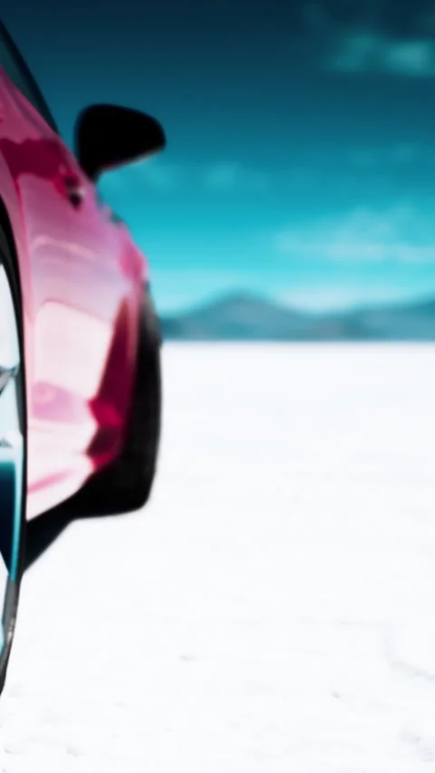 Car tire on salt flat with mountains and blue sky in the background Stock Footage 337969289
