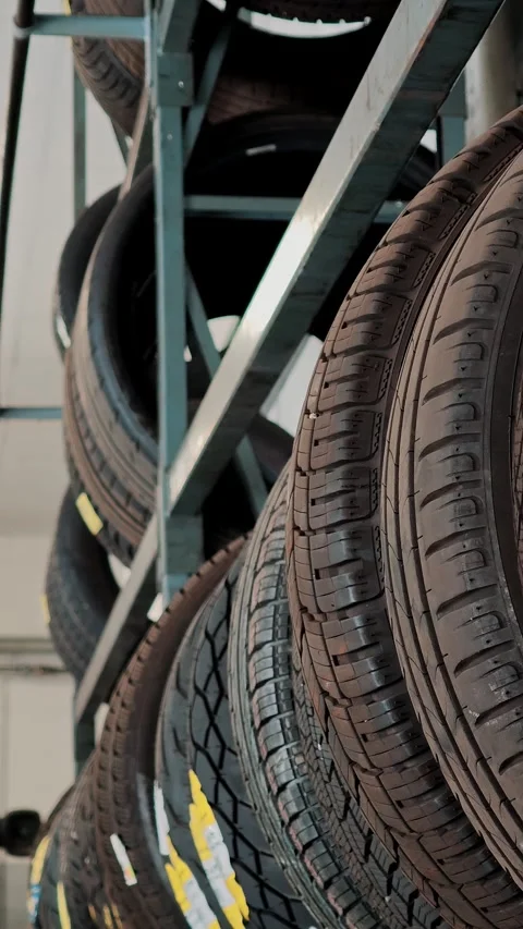 Car Tire Tread Pattern Closeup on Storage Rack at Auto Shop Stock Footage 332828288