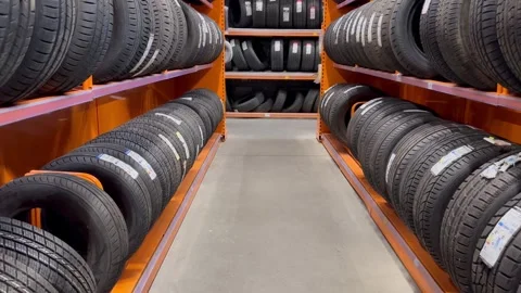 Car tires in the store Stock Footage 242625842