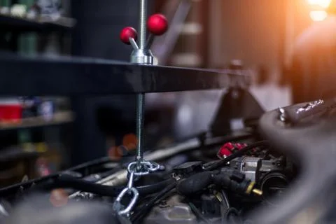 Car tool for engine mount close up with beautiful sun on background Foto stock