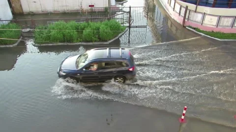 The car is a top view on sidewalk flooded with water Stock Footage 64352666