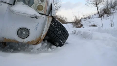 Car with torn off wheel on winter road Stock Footage 149873360