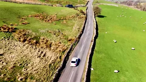 Car tracking scenic drive on a road in scotland,  highlands and mountains Stock Footage