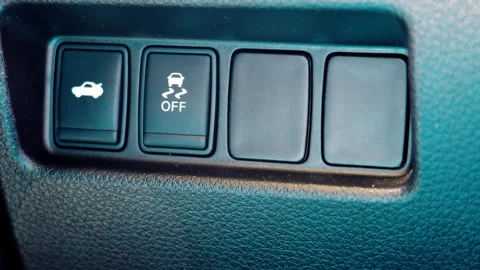 Car traction control off and trunk release dashboard switch buttons Stock Footage 335603701