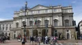 Car Traffic and People Crowds Walking Opera Scala Square Old Tram Passing Milan HD Footage