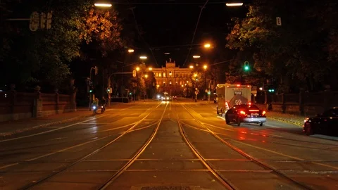 Car traffic and trams in front of The Maximilianeum palace at night, Munich, Ger Stock Footage 92353040