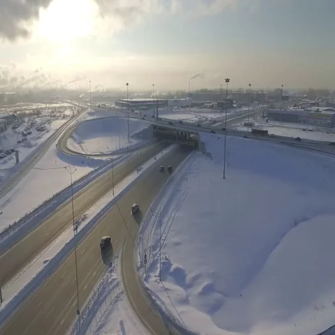 Car traffic on the big intersection and pollution smoke from factory. Stock Footage 69663880
