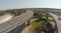 Car traffic on city road junction, railroad, view from above HD Footage