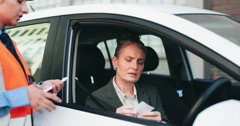 Car, traffic cop and ticket for woman, stop and fine for violation on road Stock Footage 306504938