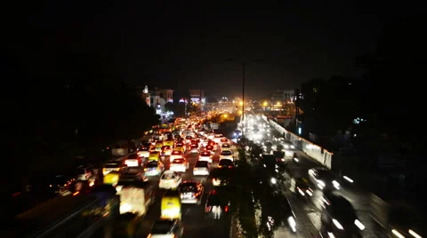 Car traffic in Delhi, India at night. Time-lapse Stock Footage