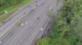 Car traffic driving fast on busy city freeway, aerial view HD Footage