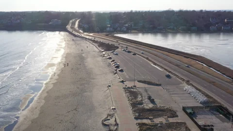 Car traffic going between Easton Pond and Easton Bay 4k Video stock 304188622