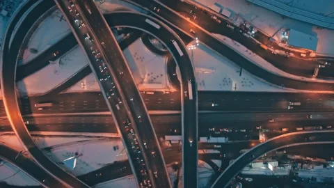 Car traffic on highway junction in winter night city top down shot. Aerial view Stock Footage 154222012