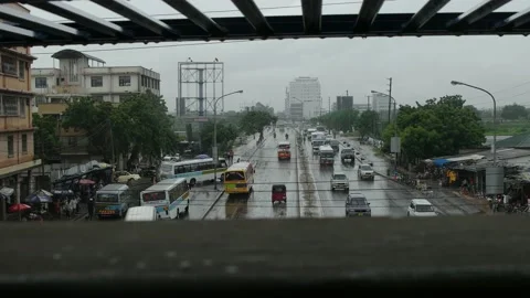 CAR TRAFFIC MOVING IN THE RAIN Stock Footage 161401736