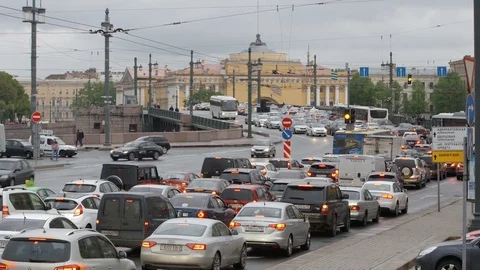 Car traffic on Palace bridge in cloudy day in summer - St. Petersburg, Russia Видео 76432814
