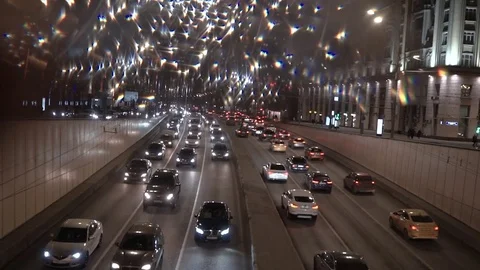 Car traffic at sunset. Bokeh background of the big city Stock Footage 74972177