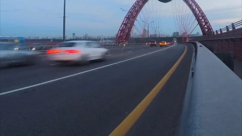 Car traffic through cable-stayed bridge in evening timelapse Stock Footage 79810500