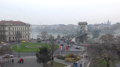Car traffic in vicinity of bridge over Danube river in Budapest Stock Footage 99908714