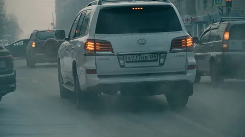 Car traffic in a winter city, poor visibility on the road Stock Footage 123745522