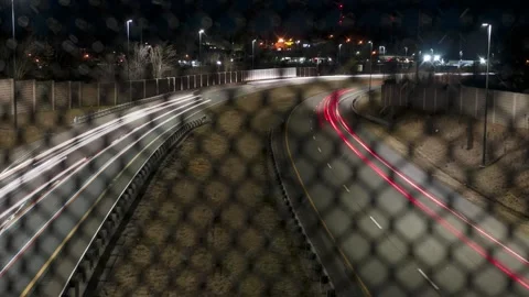 Car Trail Timelapse Looking Through a Fence Video stock 171167508