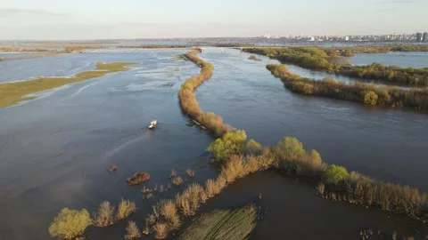 Car with a trailer is moving along a flooded road Stock Footage 190994166