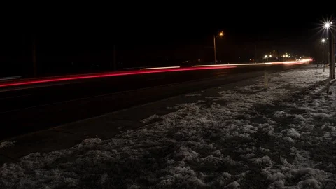 Car Trails Timelapse after a snowfall on the highway at Night, 4k Stock Footage 103245984