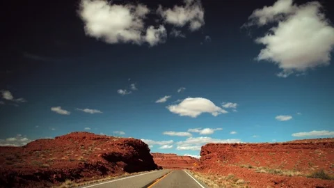 Car travelling down an empty desert road. Stock Footage 88342517