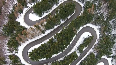 Car traversing mountain pass road, aerial view Video stock 71903862