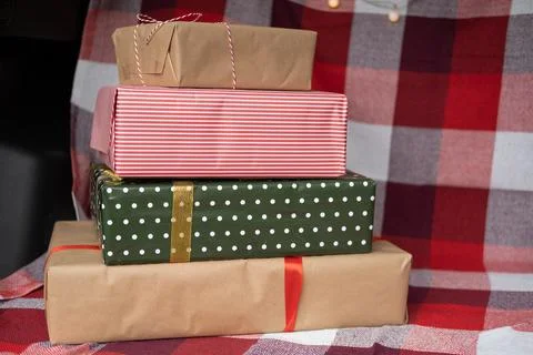 Car trunk full of gift boxes, presents and garland for Christmas holidays Stock Photos