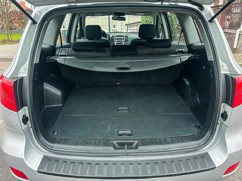 A car trunk is open with no items inside. The interior is clean and spacious. Stock Photos